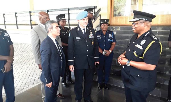 Mr Luis Carrilho (2nd left) interacting with Mr Oppong-Boanuh and some top police officers during his visit to the Ghana Police Headquarters