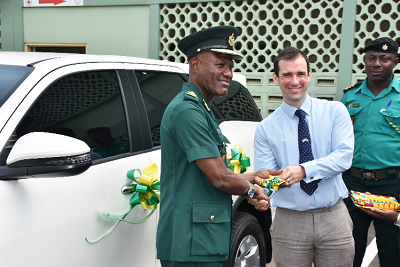 Mr Alistair Rushton (right) presenting the keys to the vehicle to Mr Kwame Asuah Takyi