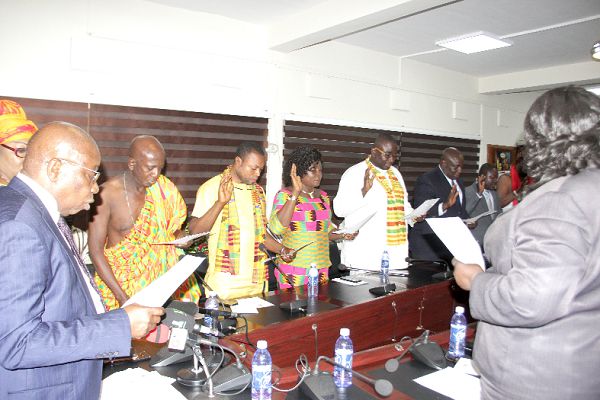 Mr Kwaku Agyemang-Manu (left), the Minister of Health swearing in the governing board of the Traditional Medicine Practice Council. Picture: EDNA ADU-SERWAA