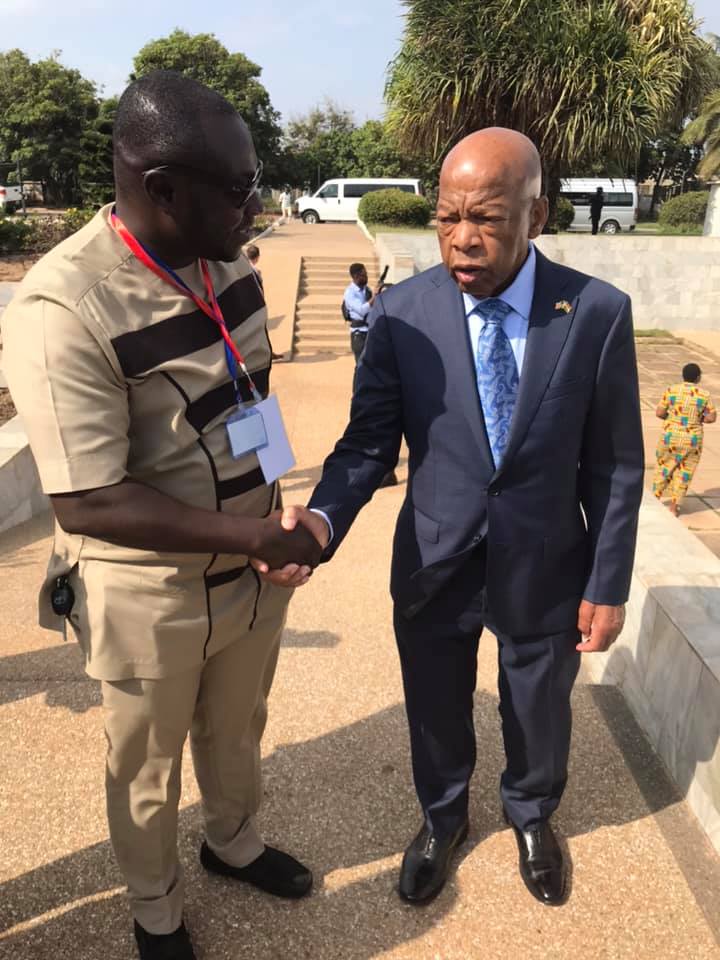 The Legendary Congressman John Lewis (right) in a handshake with Enoch Darfah Frimpong, Assistant Online Editor