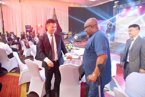 Mr George Andah (left) exchanging pleasantries with Kevin Chen, an official of Huawei. Picture: EMMANUEL QUAYE