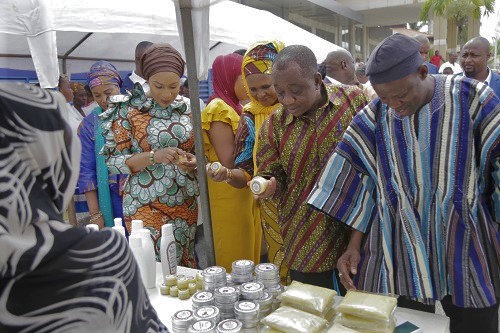 Mrs Samira Bawumia (left), the Second Lady,  together with Mr Salifu Saeed (right), the Northern Regional Minister, and Mr Solomon Namliit Boar (2nd right), the North East Regional Minister, examining some of the products made from shea butter at the exhibition as part of the launch. Picture: EMMANUEL ASAMOAH ADDAI  