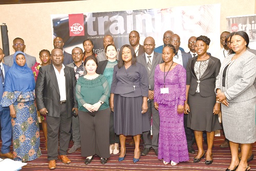 Ms Nesreen Al-Khammash (3rd left), an ILO expert, with participants after the opening session of the regional training on managing national standards development projects and programme. Picture: EBOW HANSON