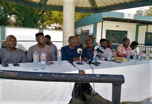 Chief Chukwuemeka Nnaji (middle), the president of the Nigerian Union of Traders Association (NUTAG) in Ghana, flanked by executive members of the association, addressing the media