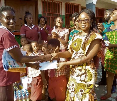 Mrs Charity Opare (left) handing over the items to Mrs Lina Amoabeng