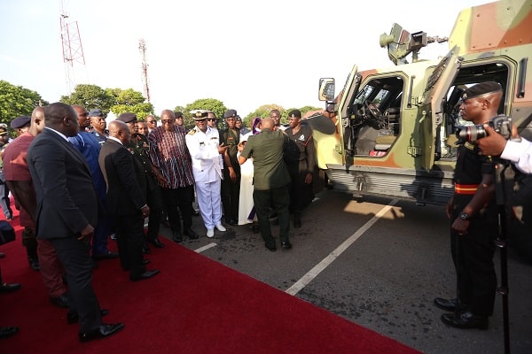 President Akufo-Addo (left) being conducted round the vehicles for the military. Pictures: SAMUEL TEI ADANO