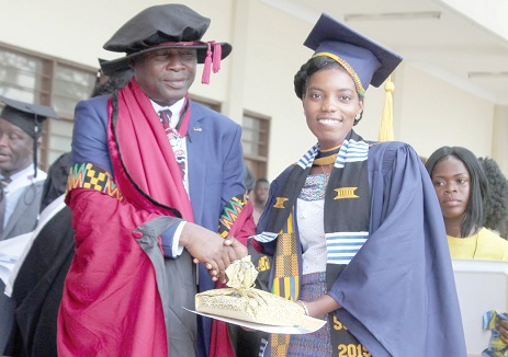 Dr Emmanuel Kobena Kotu, Director, Ghana Institute of Languages, presenting the Overall Best Student Award to Ms Marylynne Odeley Okailey Akrong (right), School of Bilingual Secretaryship   