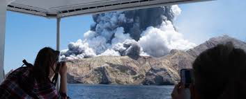 Tourists could be seen waiting to be evacuated from White Island