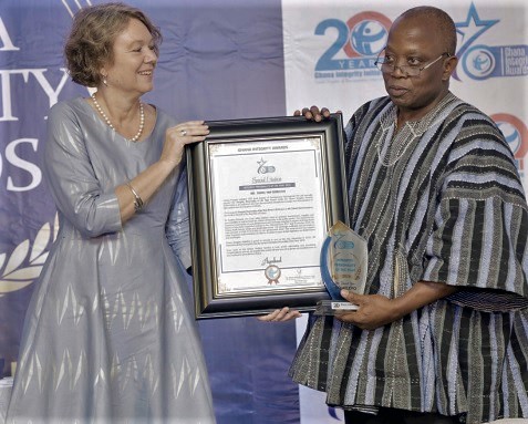  Ms Tove Degnbo (left), Danish Ambassador to Ghana, presenting the Integrity Personality of the Year Award to Mr Daniel Yaw Domelevo, the Auditor-General   