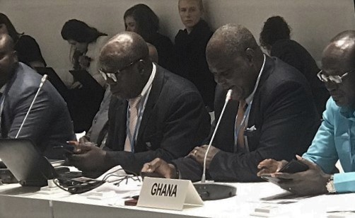  Mr John Pwamang (2nd right) presenting the report
