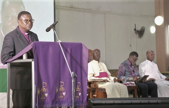 Most Rev. Prof. Emmanuel Asante (left), Chairman of National Peace Council, making a contribution at the event. 