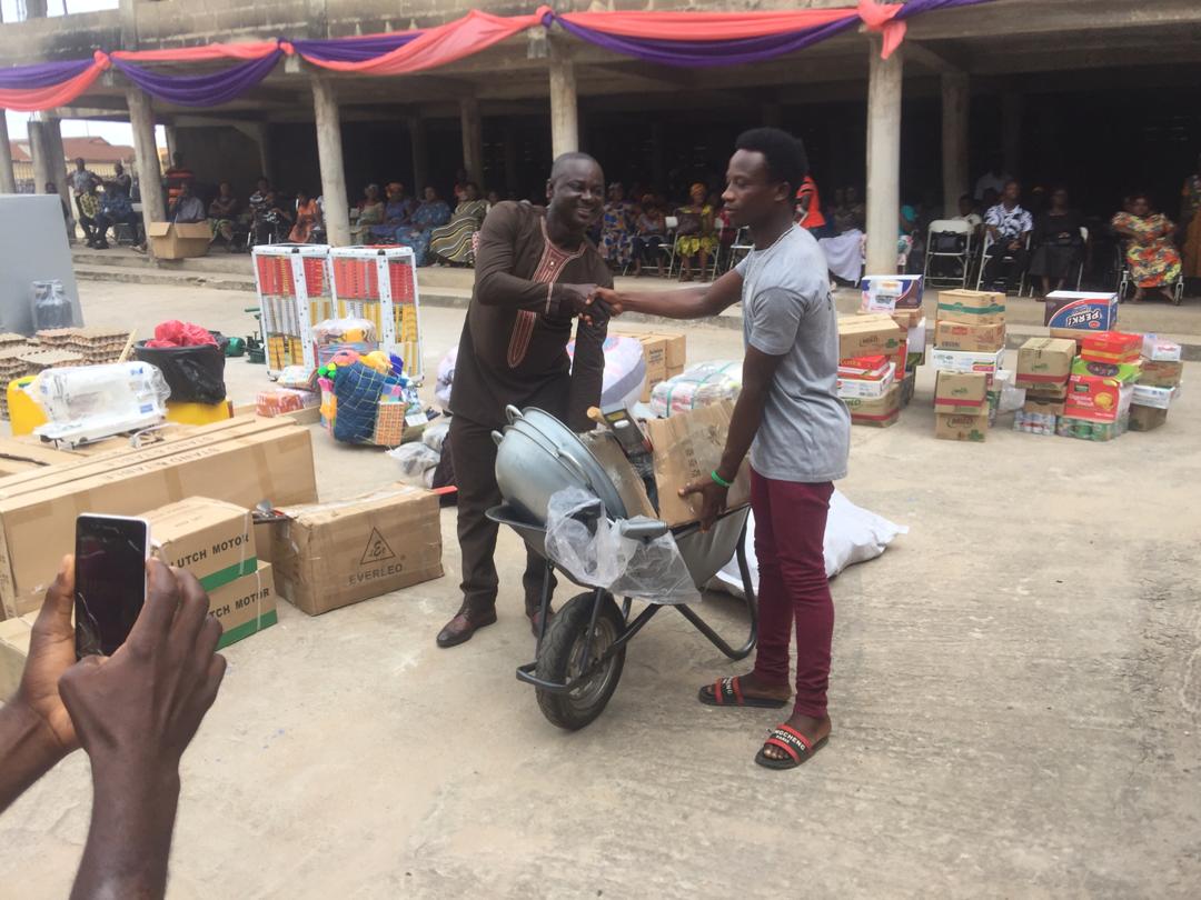 Mr. Obeng Owusu ( left) presenting masonry tools to a 23-year old Evans Asare, (right) a dumb and deaf person 
