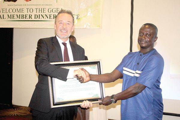 Mr Christoph Retzlaff (left) presenting the Most Impactful Media Organisation of the Year 2019 award to Mr Kwaku Tweneboa-Kodua (right), Circulation Manager of the Graphic Communications Group Limited. Picture: GABRIEL AHIABOR