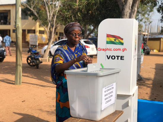 A voter casting her vote