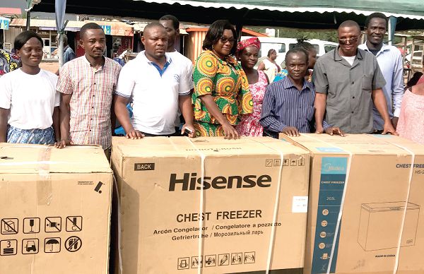  Mrs Janet Tulasi Mensah (4th left), MCE of Ga East Municipal Assembly, with some of the beneficiaries