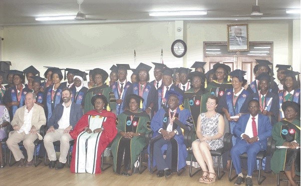 Rev. Veronica Mina Darko (seated 5th right), Chairperson of the Governing Board  of the Nursing and Midwifery Council with the graduands and other members of the academic board. 