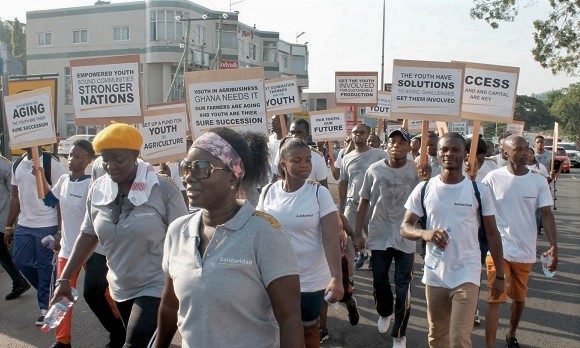 Some staff of Solidaridad, their family and friends displaying placards during the “Sustainability Walk” to support the youth to transform agriculture in Ghana. 