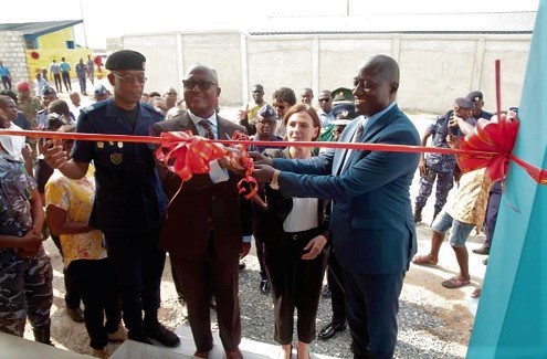 The Commissioner of the Customs Division of the GRA, Colonel Kwadwo Damoah (retd) (left), Mrs Briget La Cour Madsen (2nd right), and Mr Isaac Crentsil of the Ministry of Finance (2nd left), cutting the tape to inaugurate the dog training complex. INSET: The dog training school complex