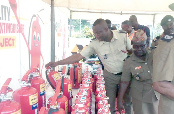  Personnel of the Fire Service checking out the products on display