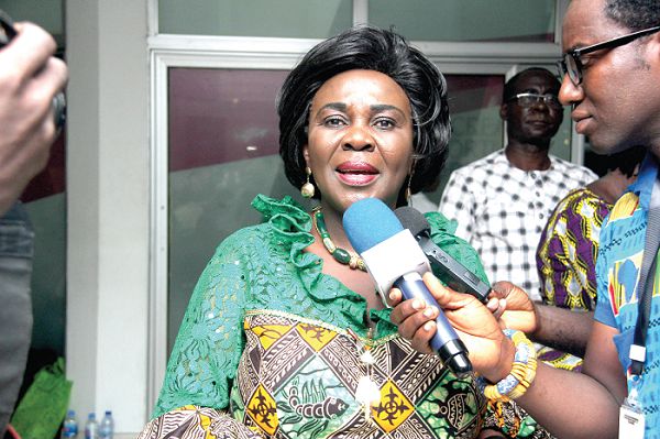 Mrs Cecilia Dapaah (right), speaking to some journalists after the programme. Participants in the  forum (left). Picture: BENEDICT OBUOBI