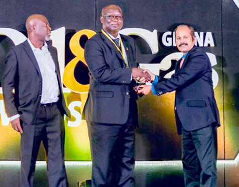 Mr Dotsey Aklorbortu (middle) receiving his award