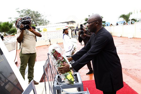  Vice-President Dr Mahamudu Bawumia laying  a wreath at the ceremony. INSET: Vice-President Dr Bawumia (right) interacting with some veterans. Picture: NII MARTEY M BOTCHWAY 