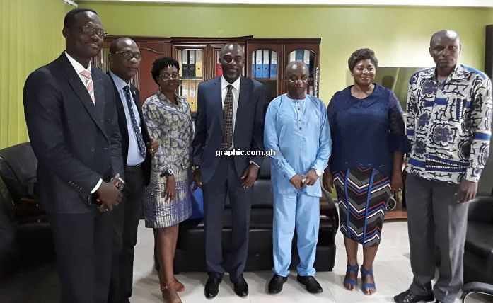 Professor Kwamena Kwansah-Aidoo (4th right) together with other GIJ officials and the management members of GBC in a group photo after their discussions 