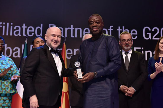 Dr Ibrahim Mohammed Awal receiving the award from  Mr Baybars Altuntas (left), the Chairman of the Board of Directors of WBAF