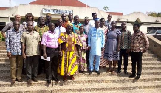 show participants at the conference in a group picture.