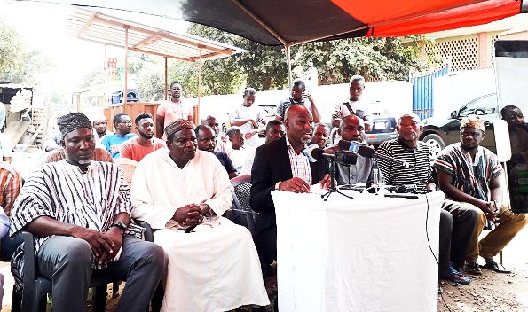  An uncle of Divela Hussein Ahmed Suale, Mr Mustapha Iddrisu, addressing the media. Looking on are other family members of the deceased