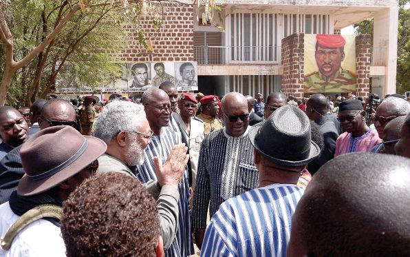 Former President Rawlings (left) and Burkina Faso President Kabore (arrowed) at the ceremony
