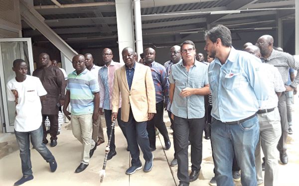 Otumfuo Osei Tutu II (3rd right) and his team being conducted around the Kejetia Market by Mr Fabio Camara (2nd right), the Chief Executive of Contracta, the contractors who worked on the project