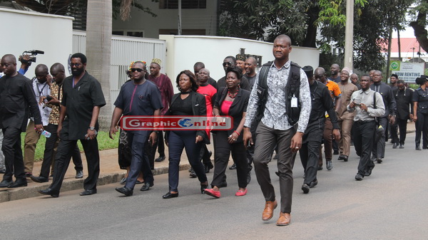 Members of the Minority in Parliament on their way to the Police Headquarters
