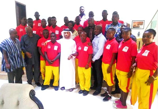 Mr Khalifa Yousif Al Zaabi (arrowed) with members of the Special Olympics team