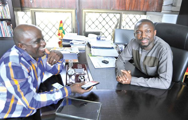 Severious Kale-Dery, the Daily Graphic reporter (left),  interviewing Mr Hayford Siaw