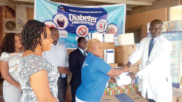  Founder of Frankel Diabetic Foundation, Lydia Agyen Frimpong, presenting the items to Dr Ebenezer Oduro- Mensah of the La General Hospital