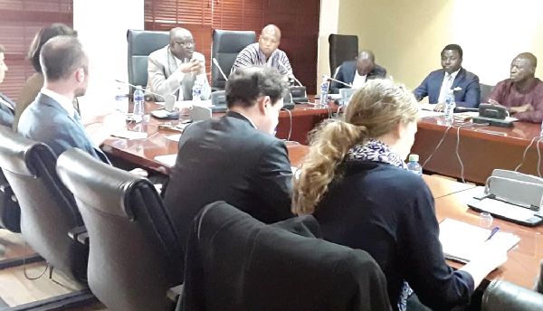 Mr Kwaku Ampratwum Sarpong (5th right) making a point at the meeting with the EU delegation