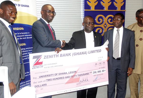  Dr Kwame Amoah Baah-Nuakoh (2nd left), presenting the cheque to Prof. Ebenezer Oduro Owusu (2nd right). With them are Mr Dominic Duah (left), Executive Director of the GNPC Foundation and Prof. Samuel Kwame Offei (right) of the UG. Picture: Maxwell Ocloo
