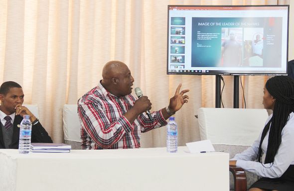 Mr Theophilus Sedodi, (2nd left), a victim, explaining a photograph to the commission during the hearing. Picture: EDNA ADU-SERWAA