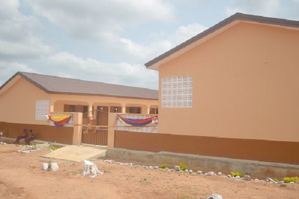  Professor Kwesi Yankah (middle) cutting the tape to inaugurate the new classroom block while Mrs Helen Essel (right), Mrs Marigold Assan (2nd right) Agona West Municipal Chief Executive, and other dignitaries look on. (INSET) The new classroom block