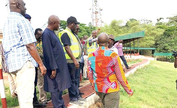 Mr Amoako Attah, Minister of Roads and Highways, (3rd left) at the Odweanoma Mountain during the inspection