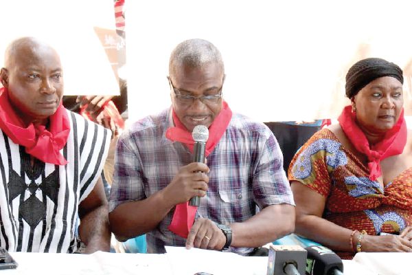 Mr Dan Taylor (middle), spokesperson for the group addressing the media
