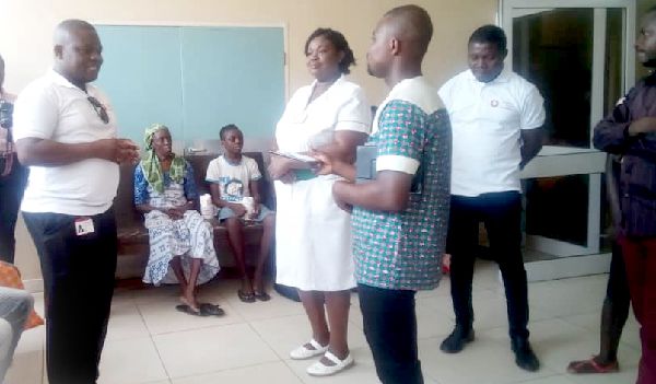 Mr Gayheart Edem Mensah (left) briefing Ms Emelia K. Okai, Principal Nursing Officer of the Neurosurgical Unit of the Korle Bu Teaching Hospital