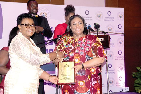 First Lady, Mrs Rebecca Akufo-Addo, presenting an award to Brig. Gen. Constance Ama Emefa Edjeani-Afenu, the first woman to become a Brigadier General in the Ghana Armed Forces (GAF), at the event. Picture: EDNA ADU-SERWAA
