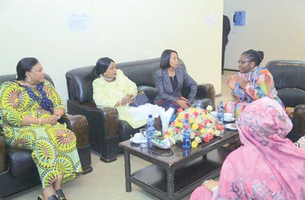 Mrs Rebecca Akufo-Addo (left), with her colleague first ladies in a discussion at the old AU building VIP holding area