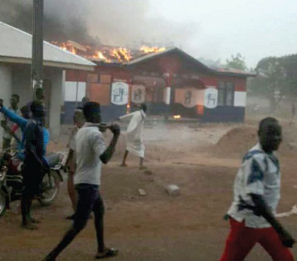 The youth in Salaga burning down the New Patriotic party (NPP) constituency office