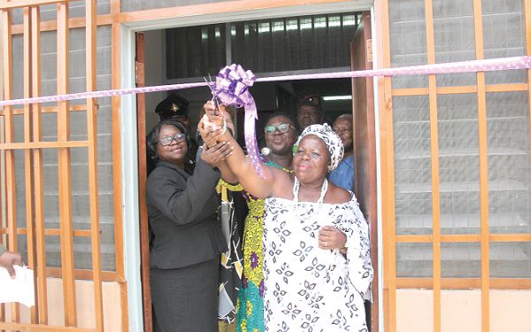 Naa Korkor Aadzieoyi (right), Adabraka Manye, raises her scissors after cutting the ribbon to inaugurate the newly built Serenity Centre at the Accra Psychiatric Hospital. Holding her hands are Mrs Wilhelmina Mensah (left) and Dr Pinaman Appau, Director, Accra Psychiatric Hospital. INSET: The new Serenity Centre. Picture: BENEDICT OBUOBI