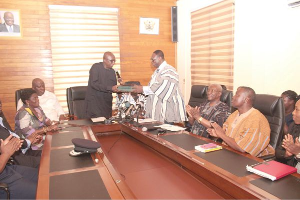 Mr Patrick K. Acheampong (right), former Inspector General of Police (IGP) and Chairman of the committee, presenting the report to Mr Ambrose Dery, Minister of the Interior. Picture: NII MARTEY M. BOTCHWAY