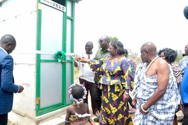 Ms Sheila Seidu (second from right) being assisted by Mr Emmaunel L. Agama (second from left) and others to inaugurate the boifil facility
