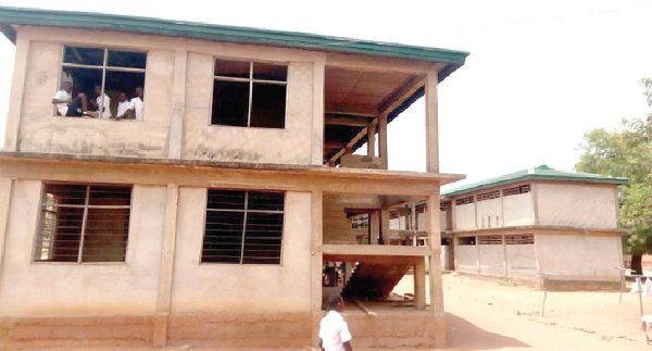 The uncompleted dormitory block being used as classrooms
